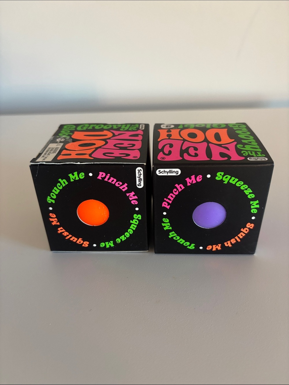 NEEDOHS  Groovy Glob Squeeze Toy - Orange and Purple